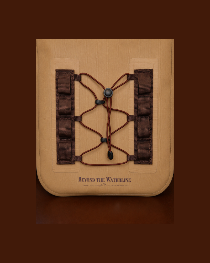 A tan canvas pouch or case with a brown lace-up front and side straps, shown centered on a dark brown background. The front has the text 'BEYOND THE WATERLINE' printed near the bottom.